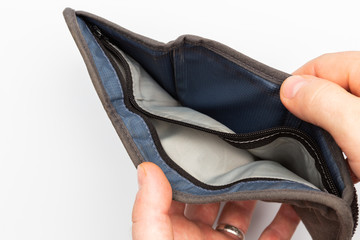 Man hands open an empty wallet on white background, top view, closeup