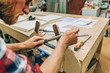 © Carlo - close up of the hands of a carpenter using a manual lime