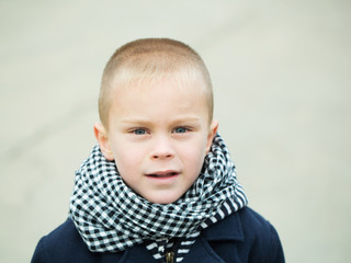 Boy on grey background.