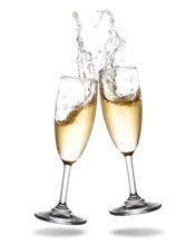 Cheers Champagne With Splashing Out Of Glass Isolated On White Background.