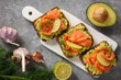 Sandwiches with avocado spread and smoked salmon.