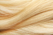 Texture of healthy blond hair as background, closeup