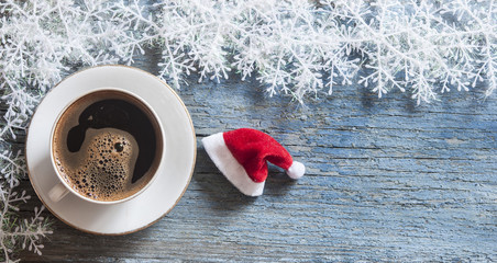 Top view of coffee cup on a wood background with copy space.