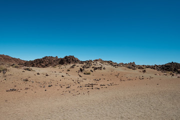 Canvas Print - desert landscape -  sand, rocks and clear blue sky copy space 