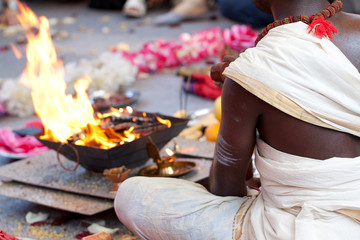 Hindu in traditional dress holds festive ceremony