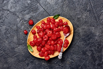 Wall Mural - Candied dried cherry on plate. Top view of berries.