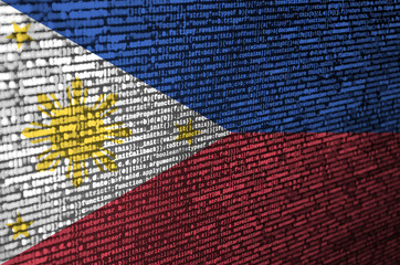 philippines flag is depicted on the screen with the program code. the concept of modern technology a