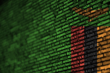 zambia flag is depicted on the screen with the program code. the concept of modern technology and si