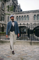 Wall Mural - A man walks the streets of Paris in Montmartre