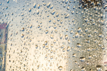 background of raindrops on window glass, close up