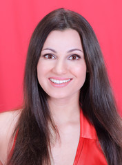 closeup . face of beautiful woman in red dress