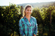 © NDABCREATIVITY - Woman winemaker with grapes in a vineyard