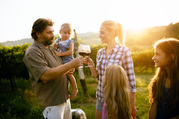 Wall Mural - Portrait of happy people spending time in vineyard