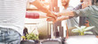 © DisobeyArt - Young teamwork stacking hands together for new startup in creative office
