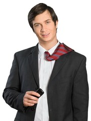 Wall Mural - Businessman with tie over shoulder holding cell phone