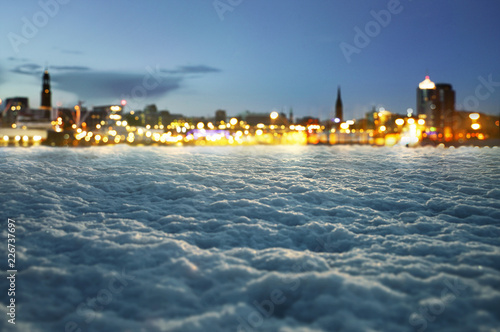 Fotomural Winter Hintergrund mit unscharfen Stadtlichtern