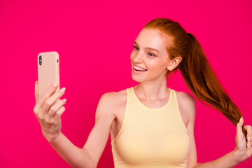 Wall Mural - Portrait of nice cheerful positive dreamy red-haired girl in tan