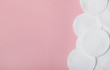 © mellisandra - Several cotton cotton pads to remove makeup on a pink background. Careful face care. Top view, flat lay, copy space