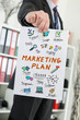 © thodonal - Marketing plan concept shown by a businessman