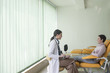 © LStockStudio - A Woman Physician Talking With Her Patient
