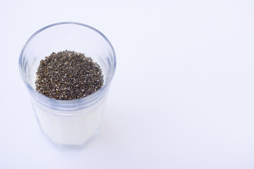 Chia seeds are drunk with airan from a glass.