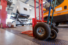 Picture Of Manual Hand Forklift In Car Workshop.