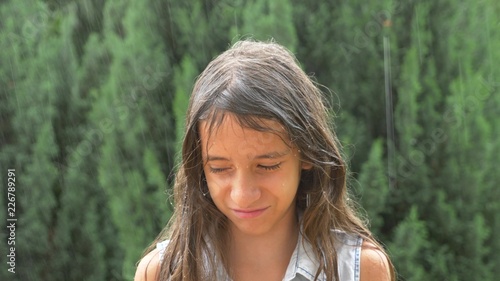 Young Sad Girl Brunette With Long Hair Standing In Pouring