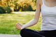© Olesia - Girl meditates while practicing yoga outdoors in park