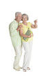 © aletia2011 - Portrait of senior couple pointing something on white background