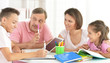 © aletia2011 - Portrait of big happy family doing homework
