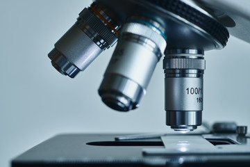 Wall Mural - close-up shot of modern microscope with sample slide at laboratory.