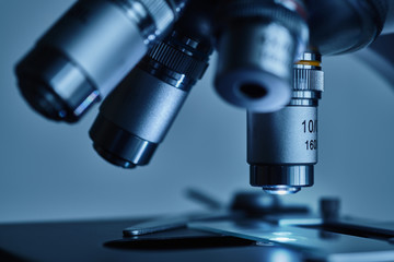 Wall Mural - close-up shot of modern microscope with sample slide at laboratory.