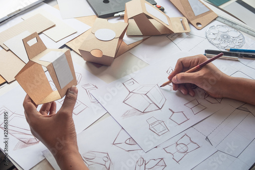 Fotomural Designer sketching drawing design Brown craft cardboard paper product eco packaging mockup box development template package branding Label