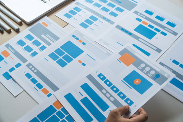 Website designer Creative planning application developer development draft sketch drawing template layout prototype framework wireframe design studio . User experience concept .