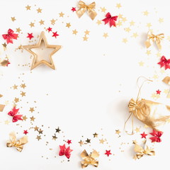 Christmas composition. Xmas red and gold decorations on white background. Flat lay, top view, copy space 