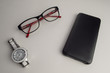 © Aleksandr Skobelev - glasses with a smartphone on a white background