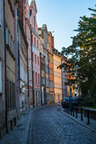 Fototapeta Uliczki - Wroclaw street in the evening. Old houses at sunset.