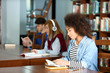 © Africa Studio - African American student studying in library
