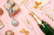 Creative flat lay composition with bottle of champagne and party accessories on color background