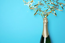 Creative Flat Lay Composition With Bottle Of Champagne And Space For Text On Color Background