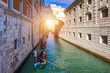 View of the famous Bridge of Sighs in Venice, Italy. Traditional Gondola and the famous Bridge of Sighs in Venice, Italy. Gondolas floating on canal towards Bridge of Sighs. Venice, Italy