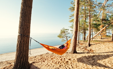 Wall Mural - Couple on beach in hammock 