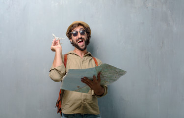 young traveler man with a map and leather bag