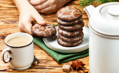 Delicious gingerbread cookies with icing sugar and chocolate for Christmas. New year. Dessert for gourmets