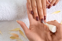 Young Woman Getting Professional Manicure In Beauty Salon, Closeup