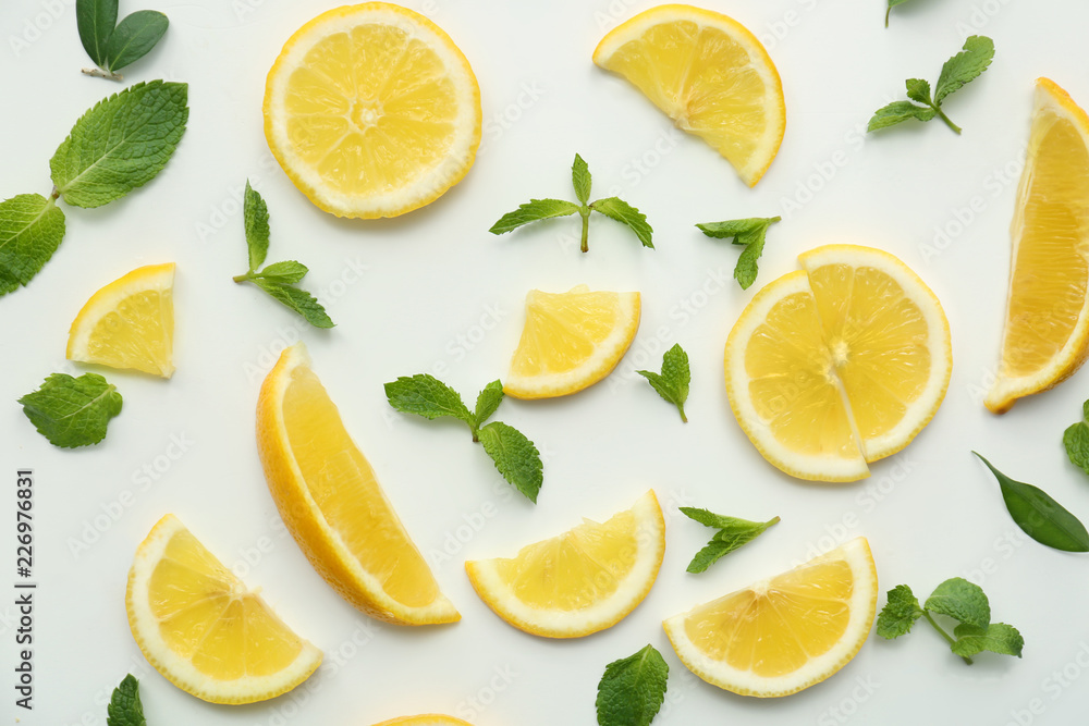 Flat lay composition with lemon slices on white background
