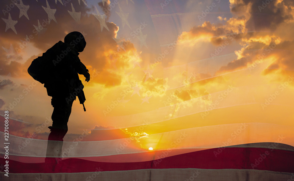 Double exposure Silhouette of Soldier on the United States flag in sunset for Veterans Day is an official USA public holiday background,copy space. - obrazy, fototapety, plakaty 