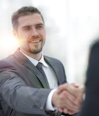 Wall Mural - closeup .handshake of business partners above the Desk