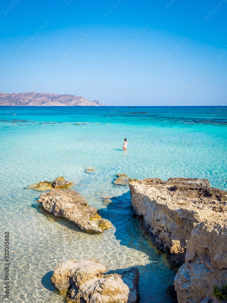 Obraz na płótnie Crete, Greece - Jul 14, 2018: Elafonisi, a paradise beach with turquoise water, an island located close to the southwestern corner of the Mediterranean island of Crete, known for its pink sand beaches w salonie