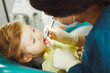 © Ilshat - Dentist treats teeth of young patient. Rules of caries prevention.